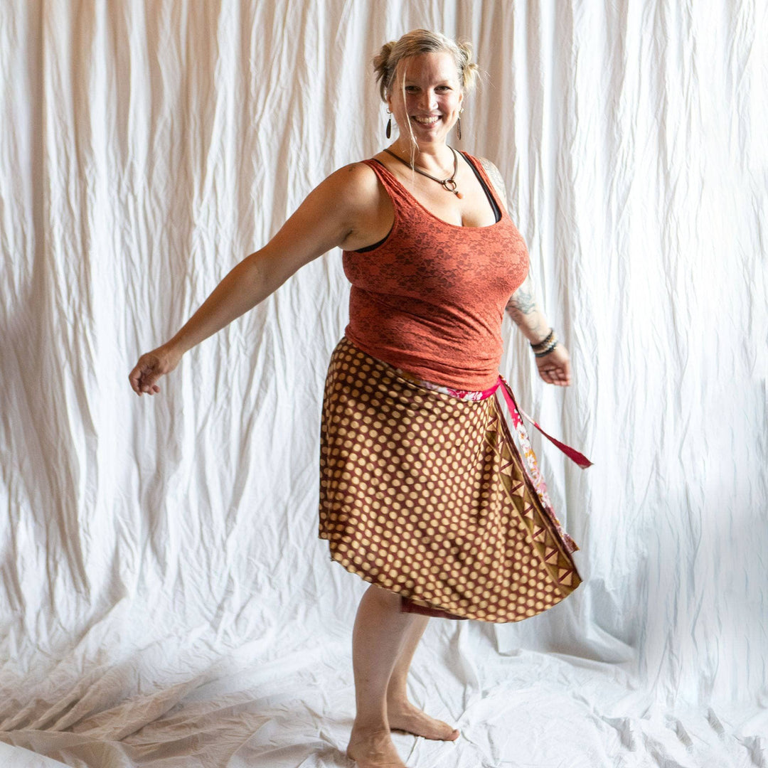 A woman wearing a reversible sari wrap skirt.