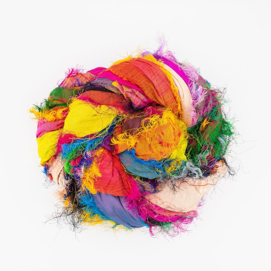 A rollled sari silk multi-colored ribbon.