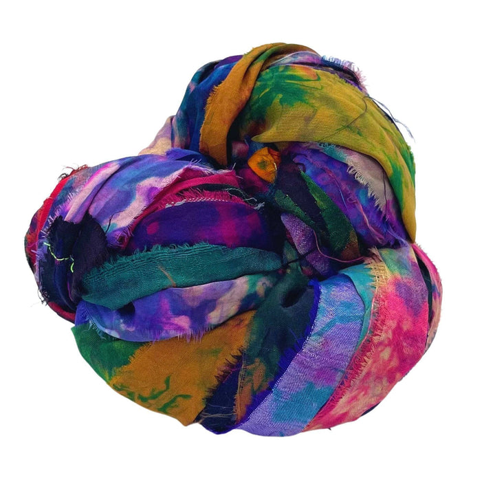 A colorful, tightly bundled fabric with green, blue, purple, pink, and yellow shades.