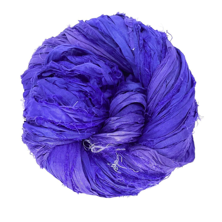 A tightly rolled ball of vibrant purple fabric strands on a white background.